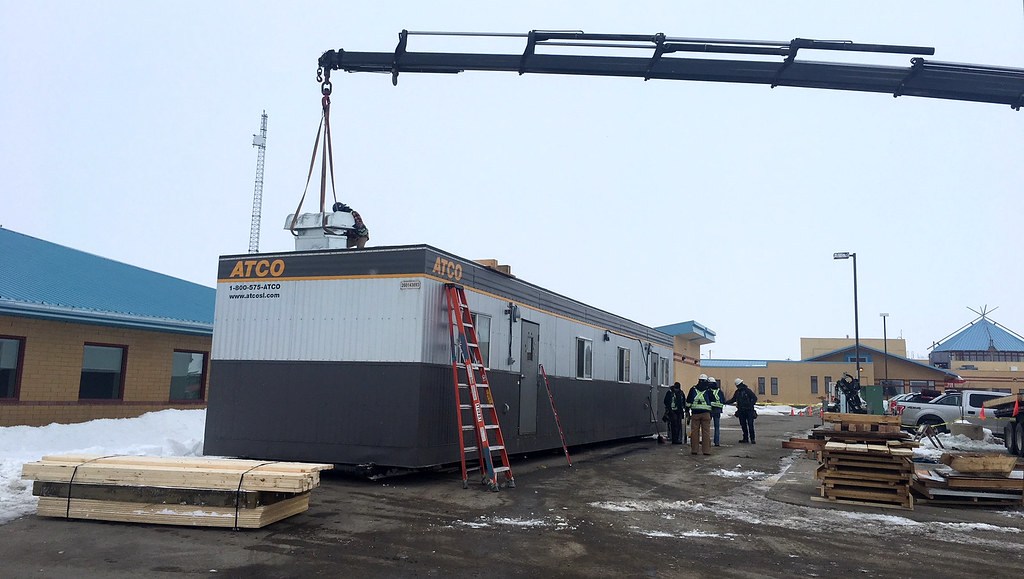Atco Trailer being hoisted by a crane